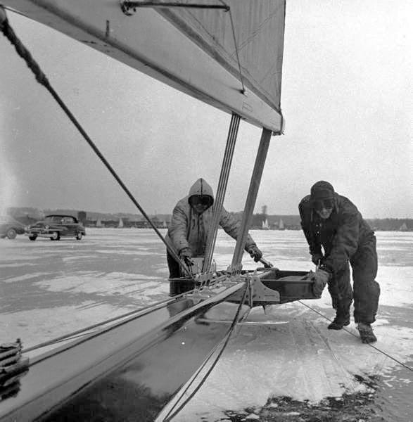 Jim Lunder And Bill Mattison Pushing Their Boat Off To Start A Race